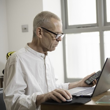 A man is working on his computer